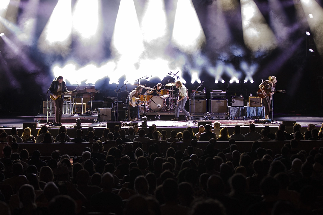 Leon Power playing drums at a stadium